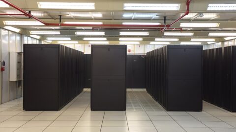 Rows of equipment inside a data centre