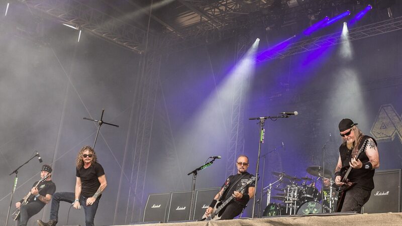A heavy metal band performing live on a festival stage