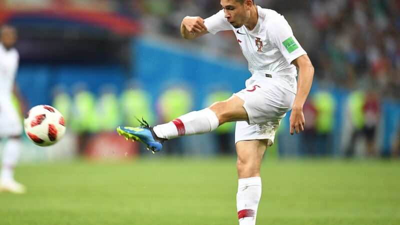 Players contesting the ball during an international football match