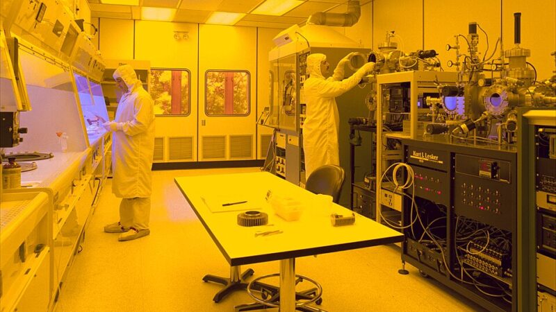 Workers inside a semiconductor fabrication cleanroom
