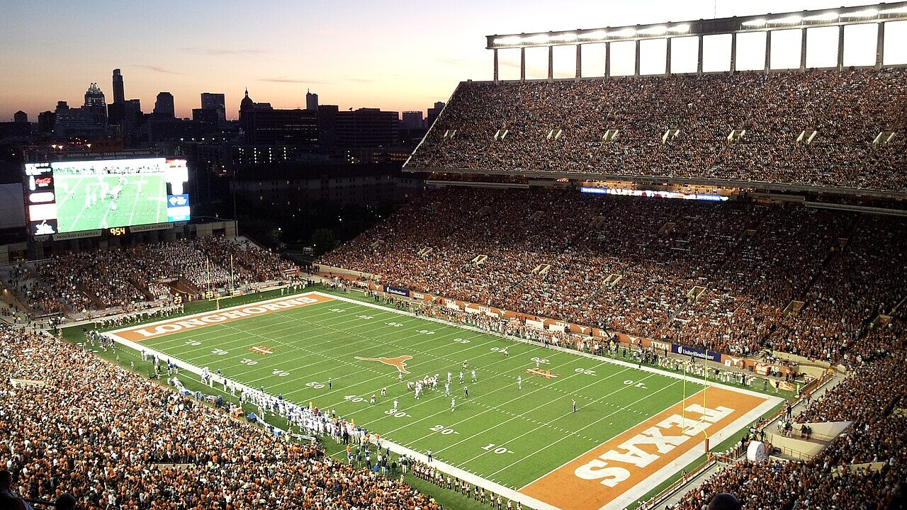 An American football stadium illuminated at night