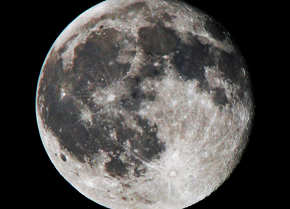 The full Moon in a dark sky