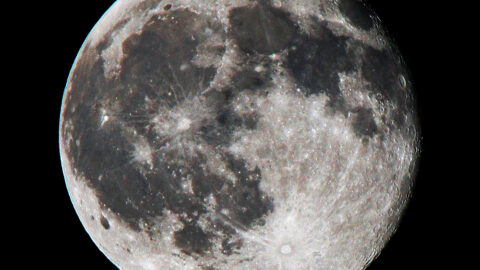 The full Moon in a dark sky