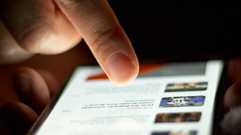 A person scrolling through a feed on a smartphone