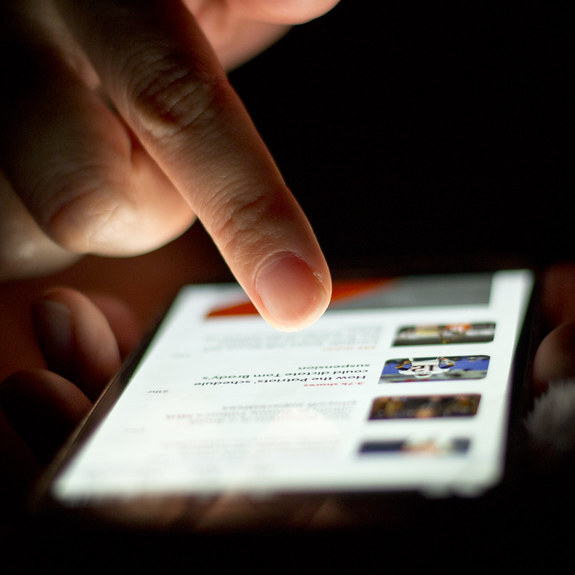 A person scrolling through a feed on a smartphone