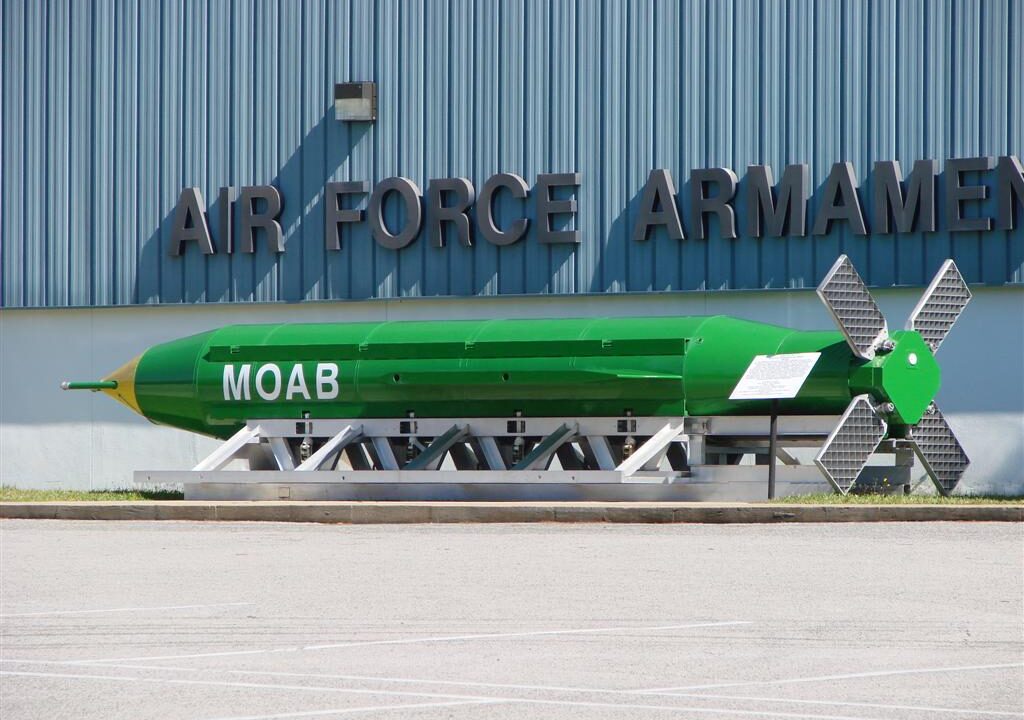 Green GBU-43/B MOAB munition labelled MOAB on display at an Air Force armament museum