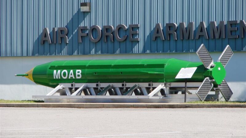 Green GBU-43/B MOAB munition labelled MOAB on display at an Air Force armament museum