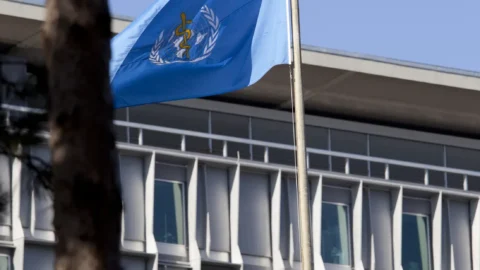 World Health Organization headquarters and flag in Geneva
