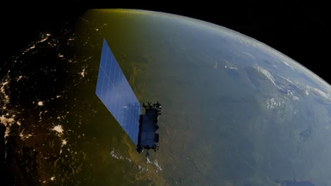 A train of Starlink satellites in orbit above Earth