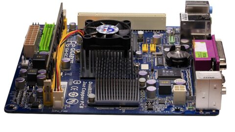 A computer motherboard with a central processor and cooling fan